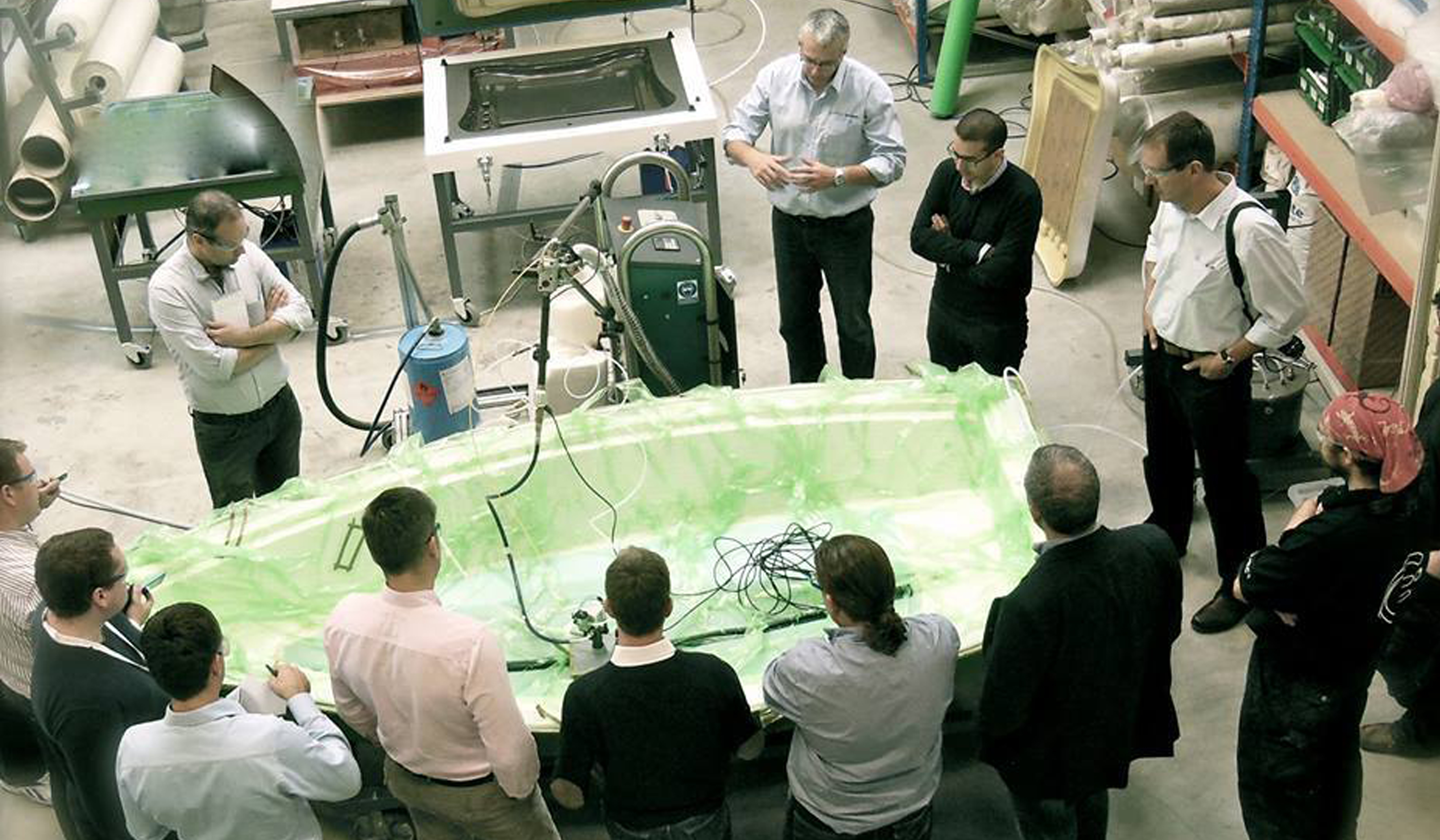 Training session demonstrating resin transfer moulding (RTM) with CIJECT equipment as part of transition from hand layup to closed moulding